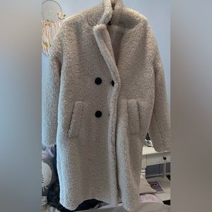Beautiful wool coat. Length- right above the knee. Has four buttons and pockets